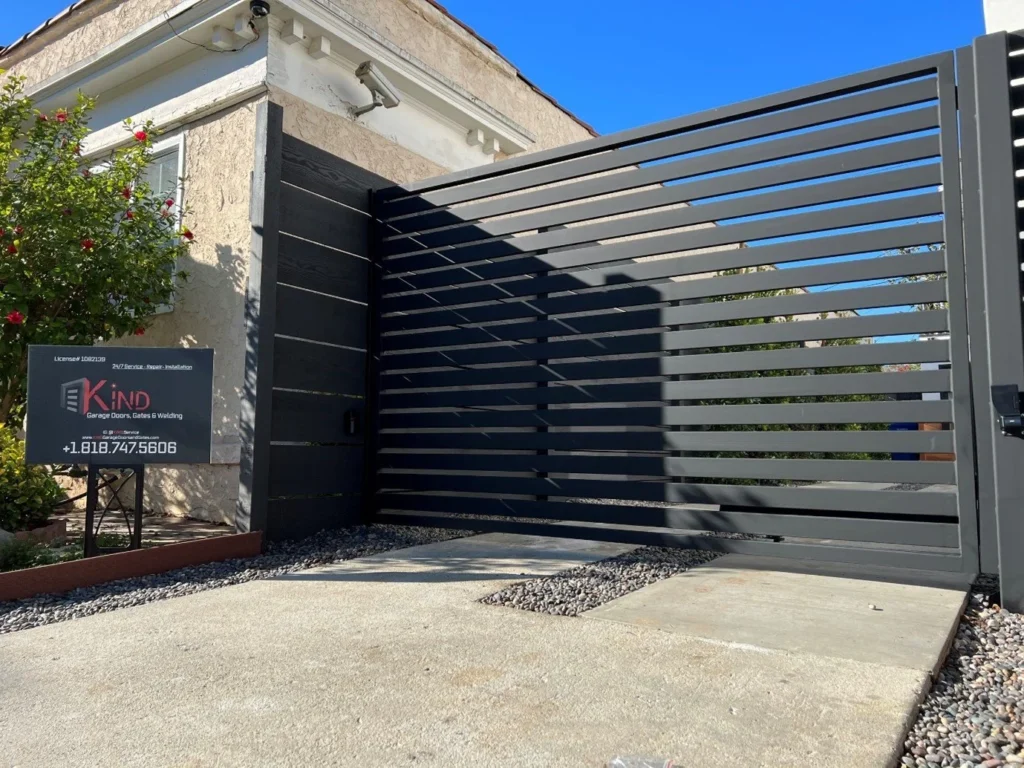 Expert handling Gate Repair by adjusting misaligned gate tracks for proper movement