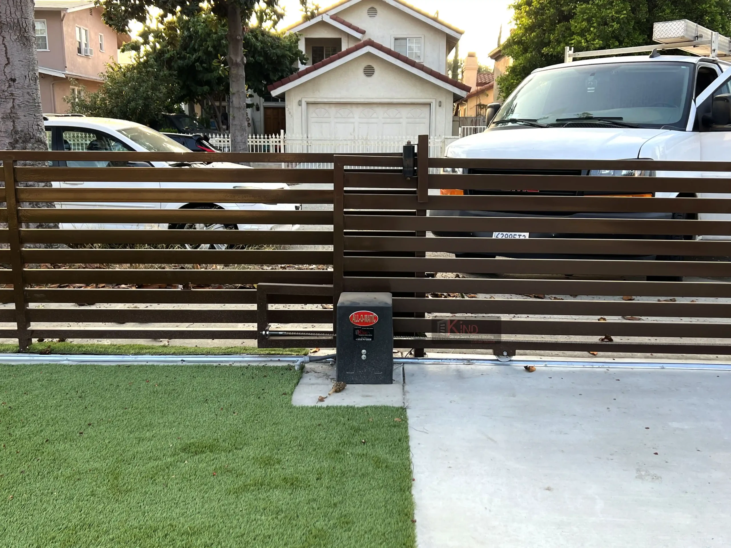 Gate Repair in Culver City technician repairing a residential driveway gate in a suburban home near Carlson Park